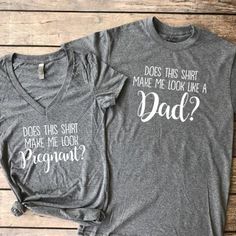 two t - shirts that say, something has a secret and someone has a pregnant