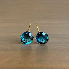 The stately elegance of London blue topaz takes on a playful form in these bewitching earrings.

18k yellow gold 
Topaz 13mm x 16mm (9/16" x 5/8")
Earrings hang 15/16" from the ear 
Each earring weighs 3.2g Petal Earrings, Gold Topaz, Jewelry By Material, Newport Ri, London Blue Topaz, London Blue, Bracelet Gift, Ring Necklace, Newport