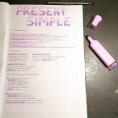 a notepad with writing on it next to a pen and eraser in the background