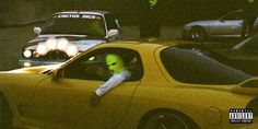 a person in a yellow car with neon green lights