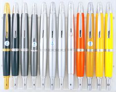 several different types of pens lined up next to each other