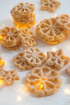 some cookies are on a white plate with lights around them and there is no image here to provide a caption for