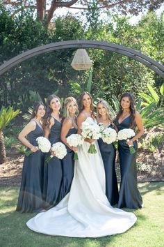 a group of women standing next to each other