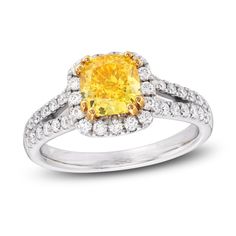 a yellow diamond ring with two rows of diamonds around it