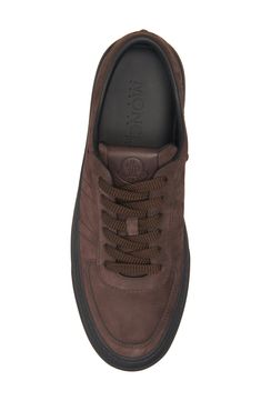 Crafted from coffee-colored nubuck leather, this versatile sneaker serves signature style with a cutout bell logo carving the counter. Lace-up style Leather upper and lining/rubber sole Imported Designer Shoes Luxury Brown Leather High-top Sneakers, Brown Leather Sneakers With Embossed Logo, Sporty Brown Calf Leather Custom Sneakers, Sporty Brown Custom Calf Leather Sneakers, Sporty Custom Brown Calf Leather Sneakers, Brown Leather High-top Sneakers With Perforated Toe Box, Brown High-top Calf Leather Sneakers, Designer Brown Sneakers With Stitched Sole, Bell Logo