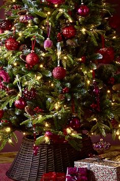 a christmas tree with presents under it