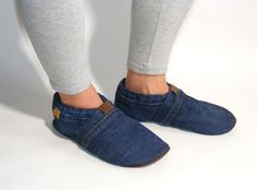 Slippers MOCCA LEO Denim dark blue The slippers Mocca Leo by SueHo are light and comfortable shoes that fit your feet perfectly. The sole is made of  recycled natural leather and the upper is made of recycled denim. An integrated elastic band allows for quick dressing. It adapts perfectly to the ankle and guarantees a secure hold. The cut and the soft leather allow a wearing comfort like walking barefoot. Available in different color combinations. The minimalist upcycling products from SueHo combine sustainability with simple design. The products are mainly made of used denim and recycled leather from post consumer waste, so there may be slight variations in color. All products are unique and are handmade in my studio in Strasbourg. Casual Slip-on Slippers With Soft Sole, Casual Everyday Slip-on Slippers, Casual Blue Slippers With Soft Sole, Blue Casual Slip-on Slippers, Fun Slippers, Walking Barefoot, Comfortable Slippers, Barefoot Shoes, Recycled Denim