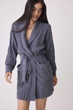 Wrap yourself in luxury with our Women’s Chenille Cozy Cable Shawl Collar Robe. Crafted from plush chenille with a beautiful cable texture, this robe offers unparalleled softness and warmth. The classic shawl collar provides an extra touch of comfort, while the tie-waist allows for a customizable fit. Perfect for lounging at home or unwinding after a long day, this robe combines style and coziness in one indulgent package. Winter Blouses, Mohair Cardigan, Mohair Sweater, Grey Pullover, Long Day, Boutique Design, Men's Knit, Loungewear Shorts, Wool Dress