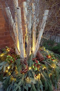 a christmas tree with pine cones and lights