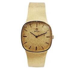 1970's Unisex Omega 29mm Vintage 14K Yellow Gold Watch with Textured Champagne Dial. Pre-Owned Brand: Omega. Gender: Unisex. Case Back: Solid. Case Size: 29mm. Crystal: Sapphire. Band Type: Bracelet. Condition: Very Good. Hands: 14K Yellow Gold. Dial Color: Champagne. Watch Label: Swiss Made. Case Shape: Semi Square. Total Weight: 54.9 Grams. Case Material: 14K Yellow Gold. Band Material: 14K Yellow Gold. Bezel Material: 14K Yellow Gold. Movement: Self-Winding (Automatic). Bracelet Size: Fit 7.7 Retro Yellow Gold Watches For Formal Occasions, Retro Yellow Gold Formal Watch, Retro Gold Watch Accessories For Formal Occasions, Zenith Watches, Chanel Watch, Sapphire Band, White Gold Sapphire, Color Champagne, Jewelry Repair