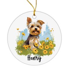 a round ornament with a small dog on it's face and name