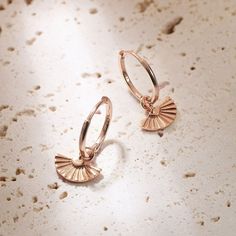 This is a customizable pair of fine hoop earrings made from 18 karat gold-plated sterling silver, with small, fan-shaped earring charms, detail lines engraved into their surface. Perfect for mixing and matching with other hoop earrings or charms to build your own unique earring stack.  🎁 Packaging: Beautifully packed in a box, ready for gifting. 🏷️ This product is made of sterling silver -- easily recognizable by its '925' stamp of authenticity. It is also hypoallergenic, making it suitable for people with sensitive or irritable skin. We recommend avoiding perfume, deodorant or other chemicals. Details: ✅ Gold hoop earrings - 925 sterling silver with 18K gold plated. Rose gold hoop earrings - 925 sterling silver with 18K rose gold plated. ✅ Diameter: hoop (inner diameter) - 1.3 cm, (oute Rose Gold Plated Huggie Earrings, Rose Gold Sterling Silver Hoop Earrings Fine Jewelry, Rose Gold Sterling Silver Hoop Earrings, Rose Gold Hypoallergenic Dangle Huggie Earrings, Rose Gold Plated Drop Earrings, Rose Gold Plated Huggie Earrings As Gift, Delicate Rose Gold Small Hoop Huggie Earrings, Gift Rose Gold 14k Gold Filled Huggie Earrings, Gift Rose Gold Huggie Earrings, 14k Gold Filled