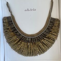 Elevate Your Fashion Game With This Stunning Stella & Dot Pegasus Bib Statement Necklace. The Elegant Piece Is Made Of Silk Organza And Metal, With A Gold Color That Complements Any Outfit. The Necklace Is 18 Inches Long And Features A Lobster Closure For Secure Wear. This Vintage Necklace Has A Bohemian Theme And Is Perfect For Women Who Want To Make A Statement. The Bib Style Adds An Element Of Glamour And Sophistication To Any Outfit. While The Necklace Is Pre-Owned, It Is In Excellent Condition And Has No Stones Or Diamonds. Buy This Unique Piece From A Trusted Brand, Stella & Dot, And Add It To Your Jewelry Collection Today. Great Condition. Comes With Original Box. Bohemian Theme, Dot Jewelry, Silk Organza, Stella And Dot, Vintage Necklace, Fashion Games, Womens Jewelry Necklace, Unique Pieces, Gold Color