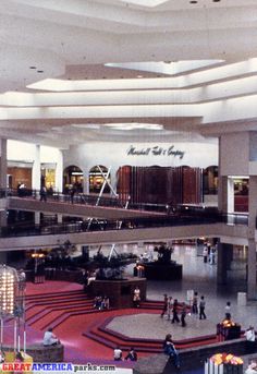 the inside of an airport with people walking around