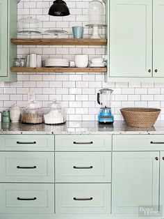 a kitchen with green cabinets and white subway backsplash, including the words corall food containers