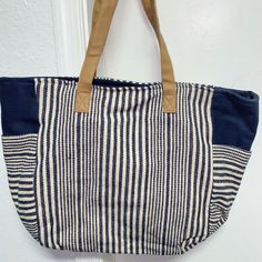 Nautical Navy Blue And White Tote Bag With Two Side Pockets, Small Inside Pocket (For Cellphone Or Keys), And Magnetic Clasps To Close. Tan Handles. Perfect For Purse, Diaper Bag, School Bag Or Work! Brand New! Casual Striped Shoulder Bag With Adjustable Strap, Chic Blue Canvas Bag With Large Capacity, Chic Large Capacity Blue Canvas Bag, Blue Canvas Beach Bag For Daily Use, Blue Canvas Bag For Everyday Use In Spring, Casual Striped Beach Bag For Everyday Use, Chic Striped Bags For Vacation, Casual Blue Canvas Beach Bag, Casual Blue Canvas Bag For Vacation