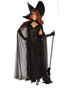 a woman dressed in a black witch costume