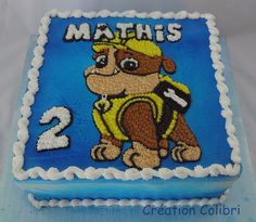 a birthday cake with a monkey on the front and number 2 on the back for maths