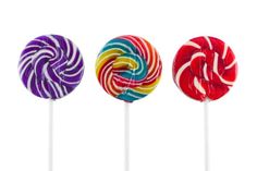 three colorful lollipops on a white background