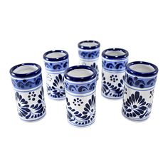 six blue and white cups sitting next to each other