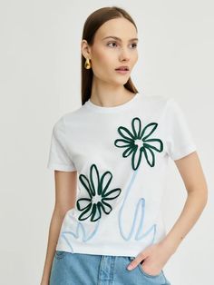 This floral take on the white tee features a pattern which uses recycled jersey yarn that’s been hand-sewn onto an organic cotton t-shirt. The baby blue and forest green detailing gives the white t-shirt a pop of colour. Want to take it up a notch? Pair with the Fauna patterned jeans for the ultimate flora and fauna style. Semi-fitted style Round neck Ribbed collar 100% certified organic compact ring-spun cotton Pattern is sewn on with recycled jersey yarn Model is 179cm wearing a top size 8. The Fabric: 100% organic compact ring-spun cotton & recycled jersey yarn Care Instructions 30° delicate wash or hand wash Artistic Garden, Maternity Nightwear, Flora Print, Patterned Jeans, Recycled Denim, Flora And Fauna, White Tee, Clothing Co, White T Shirt