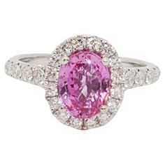 Gorgeous 2.06 ct. bright pink sapphire oval with 0.70 ct. good quality white diamond rounds. Handmade in 18k white gold in ring size 6.25. GIA certificate included. Pink Diamond Sapphire Ring, Gia Certified, Gia Certified Pink Sapphire In White Gold Ring, Gia Certified White Gold Ring With Pink Sapphire, Fine Jewelry Pink Diamond Ring In Platinum, Pink Brilliant Cut Sapphire Ring In Platinum, Pink Sapphire Ring With Brilliant Cut In Platinum, Pink Sapphire Brilliant Cut Platinum Ring, Gia Certified Pink Platinum Rings, Pink Platinum Sapphire Ring With Brilliant Cut