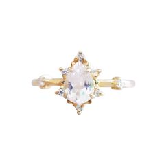 This ring is an elegant beauty for the ages. A peachy morganite set 14K solid gold. Definitely a timeless classic. Available in yellow gold vermeil, rose gold, and silver. Material: - 14K solid gold - Natural Morganite 7x5mm - Round CZs **This item is made to order, please allow 1-2 weeks for your order to be shipped. Shipping: Domestic: Ship via USPS priority mail International: $15 for international standard shipping. $10 to Canada. Online Return Policy: Due to the made to order nature, this r Classic Morganite Diamond Ring In Yellow Gold, Elegant Gold Teardrop Moonstone Ring, Classic Gold Morganite Jewelry, Heirloom Gold Ring With Morganite, Elegant Teardrop Morganite Rings, 14k Gold Pear-shaped Jewelry With Rose Cut Diamonds, Classic Morganite Gold Jewelry, Elegant Gold Diamond Ring With Morganite, Heirloom Gold Morganite Ring