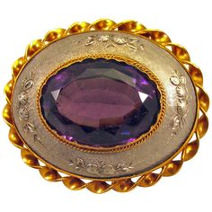 Unusual Victorian pin of aluminum, "amethyst" paste, gilt metal and mother of pearl. The aluminum is embossed with a foliate design. A bold and striking piece to wear on a shoulder or on a shawl. Aluminum was first shown at the Paris exhibition of 1855. It was made in such limited quantities that it was considered rare and was used to make jewelry. Very few pieces still exist. The pin measures 2" long by 1 3/4" wide by 1/2" deep. Antique Pins, Aluminum Jewelry, Gold Sign, Antique Brooches, Carved Shell, Diamond Brooch, Amethyst Purple, Pin Jewelry, Antique Diamond