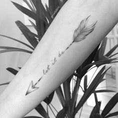 a woman's arm with a feather and arrow tattoo on the left inner forearm