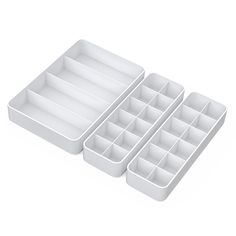 three trays with dividers are shown on a white background