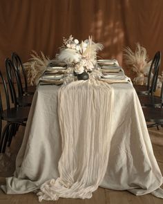 the table is set with an elegant centerpiece