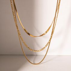 Discover Timeless Elegance with Our 18K Gold Plated Flat Snake Chain Necklace Elevate your style with our exquisite 18K Gold Plated Stainless Steel Flat Snake Chain With Letter Triple Layered Necklace. Crafted to perfection, this necklace blends vintage luxury with modern sophistication, making it a must-have accessory for every fashion-forward woman. Product Features: 18K PVD gold plating for long-lasting color and anti-scratch resistance Waterproof stainless steel material for durability Nickel, lead, and cadmium-free for skin-friendly wear Tarnish-proof design for lasting beauty Triple layered chain with flat snake chain and letter charms for a unique look Perfect for parties, anniversaries, weddings, and everyday elegance Benefits of Our Necklace: Timeless Elegance: The classic design Flat Snake Chain, Triple Layer Necklace, Men Shoes Formal, Figaro Chain Necklace, Snake Chain Necklace, Snake Necklace, Layered Chains, Layered Necklace, Watch Necklace