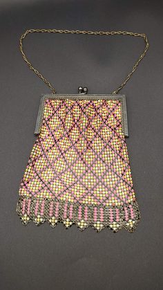 Whiting & Davis Co. Bags- Mesh Purse- Antique Mesh Purse- Enameled Mesh Purse- Antique Hand Bag- 1920s Mesh Handbag- Chain Mail Purse TE#66 This beautiful 1920s purse is a beautifully enameled Mesh purse made by Whiting & Davis Co. The piece has the original parts and pieces and is showing some wear due to the age of the piece. The metal frame itself is showing signs of discoloration as to be expected due to the age of the piece. The frame closes tight and holds well. The chain strap is holding Vintage Pink Rectangular Shoulder Bag, Vintage Pink Handheld Bag, Pink Vintage Wedding Bag, Vintage Pink Bags For Wedding, Vintage Pink Bags For Weddings, Victorian Rectangular Party Bag, Vintage Pink Evening Bags, Pink Rectangular Vintage Evening Bag, Antique Handmade Multicolor Bags