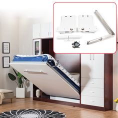 a white bed with an open drawer underneath it