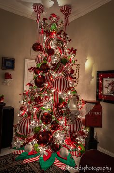 a christmas tree decorated with red and white ornaments