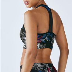 Fabletics ~ Clara Sports Bra Top~ Floral, Midi Sizes: Xs Color: Black, Pink, White, Blue -Built In Shelf Bra -T Strap Back/Racer Back - High Neck Top Condition: New With Tags! $34.95 An Update To Our Moorea Midi Bra, This Edgy Style Features A Mesh-Trim Back And Moisture-Fighting Fabric For Superior Breathability. Choose Your Support Level With Its Removable Cups Workout Top Gym Shark Athleta Nike Gym Fitness Active Reebok Athletic Alo Yoga Prana Ava Yoga Beyond Yoga Sweaty Betty Spring Black Activewear With Built-in Bra, Black Activewear With Built-in Bra For Spring, Black Sports Bra With Built-in Bra For Spring, Black Seamless Sports Bra For Spring, Spring Functional Sports Bra With Bra Friendly Design, Sports Bra With Built-in Bra For Training In Spring, Spring Training Sports Bra With Built-in Bra, Spring Training Sports Bra, Spring Black Stretch Sports Bra