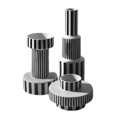 three black and white striped vases sitting next to each other