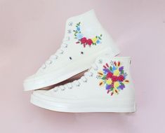 Custom Embroidered Wedding Bouquet Converse Shoes for Brides   Detailed Product Information - Shoe Type: Converse (high tops or low tops) 👟 - Customization: Hand-embroidered flowers, bees, pets, songs, wedding bouquets, birthdays, wedding dates, and more. We can bring all your ideas to life! ✨🐝 - Material: Durable, unfading embroidery on new shoes purchased directly from the store 🏬 - Note About Size: Converse shoes typically run large. Consider ordering half a size smaller if you have narrow Wedding Converse Embroidered, Embroidered Converse High Tops Wedding, White High-top Sneakers With Floral Embroidery, Converse Floral Embroidery, White Low-top Sneakers With Floral Embroidery, Shoes For Brides, Custom Flowers, Embroidered Sneakers, Converse Platform