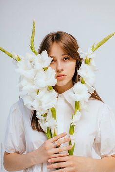 a woman holding flowers in front of her face by an unknown person for stocks on artfire