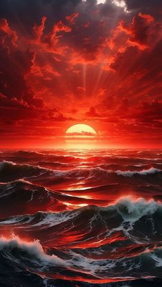 the sun is setting over the ocean with red clouds and waves in front of it