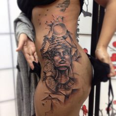 a woman with a tattoo on her stomach