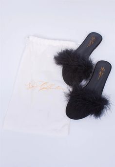 Old Hollywood glamour in the comfort of your very own bedroom? Yes, please! These slip-on, open-toe mules are the perfect exclamation point for any lingerie look. Each pair comes in its own Rya Collection-branded dust bag for easy gifting. The sizing of these ultra-luxe slippers are as follows: XS/S: Sizes 5 ½ to 7M/L: Sizes 7 ½ to 8 ½XL: Sizes 9 to 11 Made in China Polyurethane lower, turkey feather upper Feather Slippers, Slippers Black, Wear Perfume, Strappy Bralette, Turkey Feathers, Old Hollywood Glamour, Black Feathers, Monogrammed Items, Cold Shoulder Top