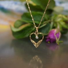 Vintage 10kt heart gold pendant on 10kt gold chain, Heart with ZC stone pendant, gold chain with gold pendantl, anniversary gift, GG19 The pendant size is 22,8 by 15,2mm with loop  Little ZC in the middle is 2,3 mm Market 10kt on pendant loop The Chain is 19,5 inch long and 0,6mm wide  Marked 10kt on loop Total weight is 2,78 gram All stones are in talk, no damages or repairs. display box is not included. The necklace will arrive in a contemporary gift box see last picture If you wish an antique Diamond Cut Yellow Gold Heart Necklace Gift, 14k Gold Heart Necklace With Diamond Cut For Gift, 14k Gold Heart Necklace For Anniversary, 14k Gold Heart Necklace With Brilliant Cut For Anniversary, 14k Gold Diamond Cut Heart Necklace, Gift 14k Gold Heart Necklace With Brilliant Cut, Antique Gold Heart Pendant Jewelry For Anniversary, Vintage 14k Gold Heart Pendant Necklaces, Vintage Yellow Gold Heart Necklace