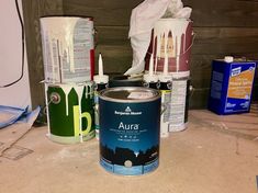 several cans of paint sitting next to each other