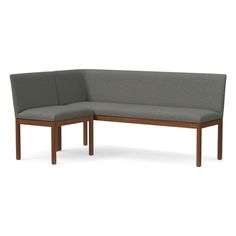 the corner bench is made out of wood and has grey fabric upholstered on it