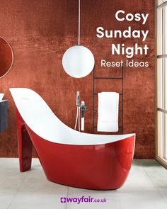 a red and white bathtub sitting next to a window in a bathroom with the words cosy sunday night rest ideas