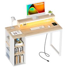 a computer desk with a monitor, keyboard and mouse on it next to a book shelf