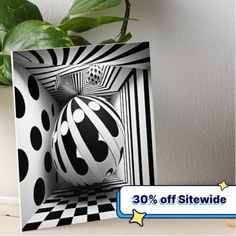 there is a black and white ball in the middle of a box with stripes on it