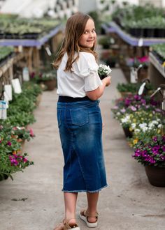 The Girls A-Line Frayed Bottom Denim Skirt is perfect for year round wear! The stretch waist will keep her comfortable and the frayed hem adds a touch of flair she will love! This is a straight fit skirt with no slit in the back, but she will still be able to walk easily in it! Fit Skirt, Vintage Indigo, Basic Design, Girls Bows, Fitted Skirt