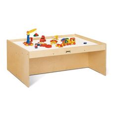 a wooden table with toy cars and trucks on it in front of a white background